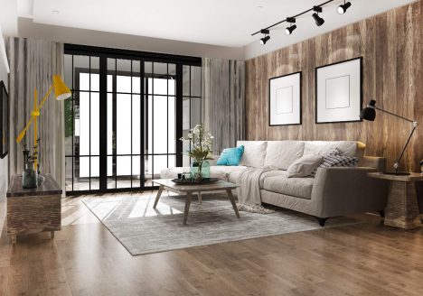 foto de sala de apartamento de luxo, com chão em vinilico, sofá cinza e grande, spots de luz no teto e uma porta de correr em preto para a varanda